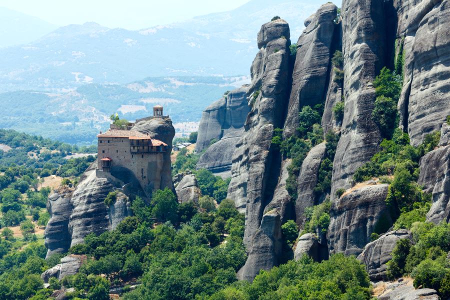 Climb up the enormous rock formations at Meteora